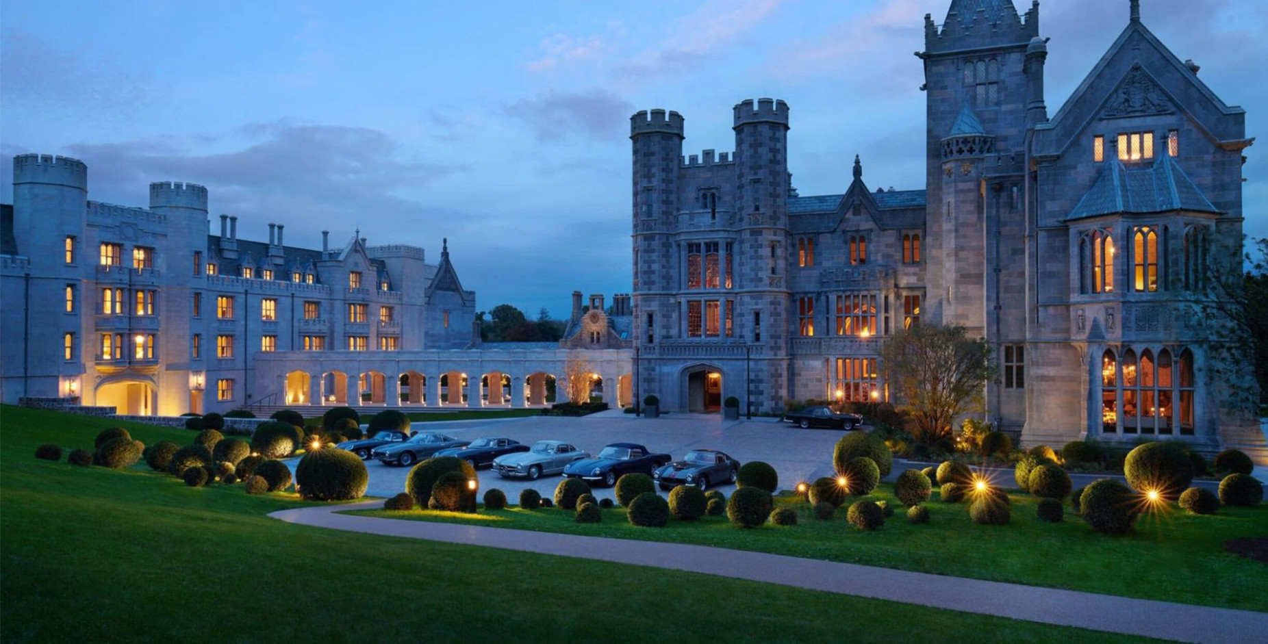 Adare Manor lit up in early evening | luxury tour of Ireland